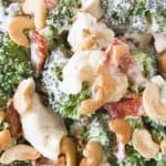 Broccoli Ranch Cashew Salad- a simple side salad that even broccoli haters love! Tossed with cauliflower, green onions, bacon and cashews! Yum!