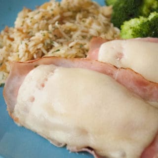 Easy Chicken Cordon Bleu This easy chicken cordon bleu is a real crowd pleaser. Moist marinated chicken, topped with ham and melted cheese. Need I say more?