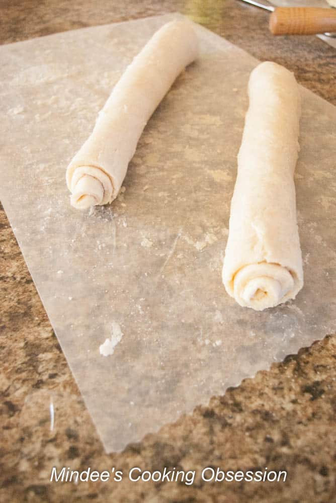Pie Dough sprinkled with cinnamon sugar and rolled up jelly roll style.