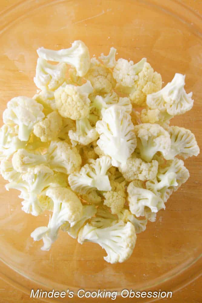 Bite size pieces of cauliflower in a bowl.