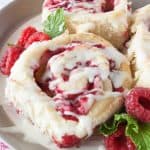 Raspberry Cheesecake Sweet Rolls- try these delicious sweet rolls that are swirled with raspberries and a cream cheese filling!