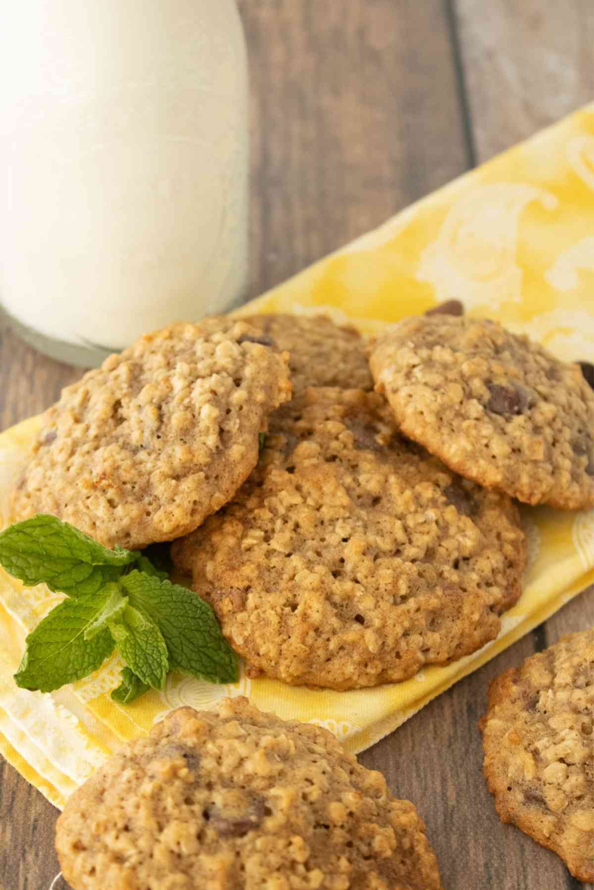 Banana Oatmeal chocolate chip cookies with a tall glass of milk.