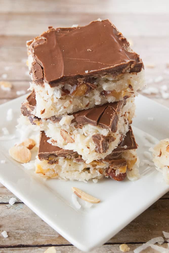 Almond Coconut Macaroon Bars stacked on a plate.
