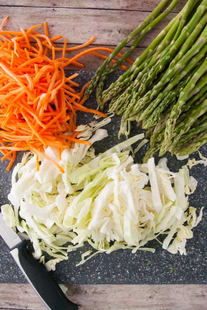 Asparagus, matchstick carrots and shredded cabbage.