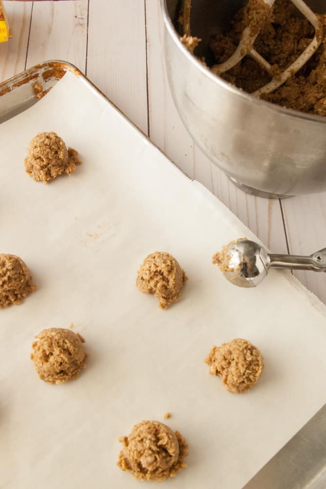 Maple pecan oatmeal cookie dough scooped out ready to bake.