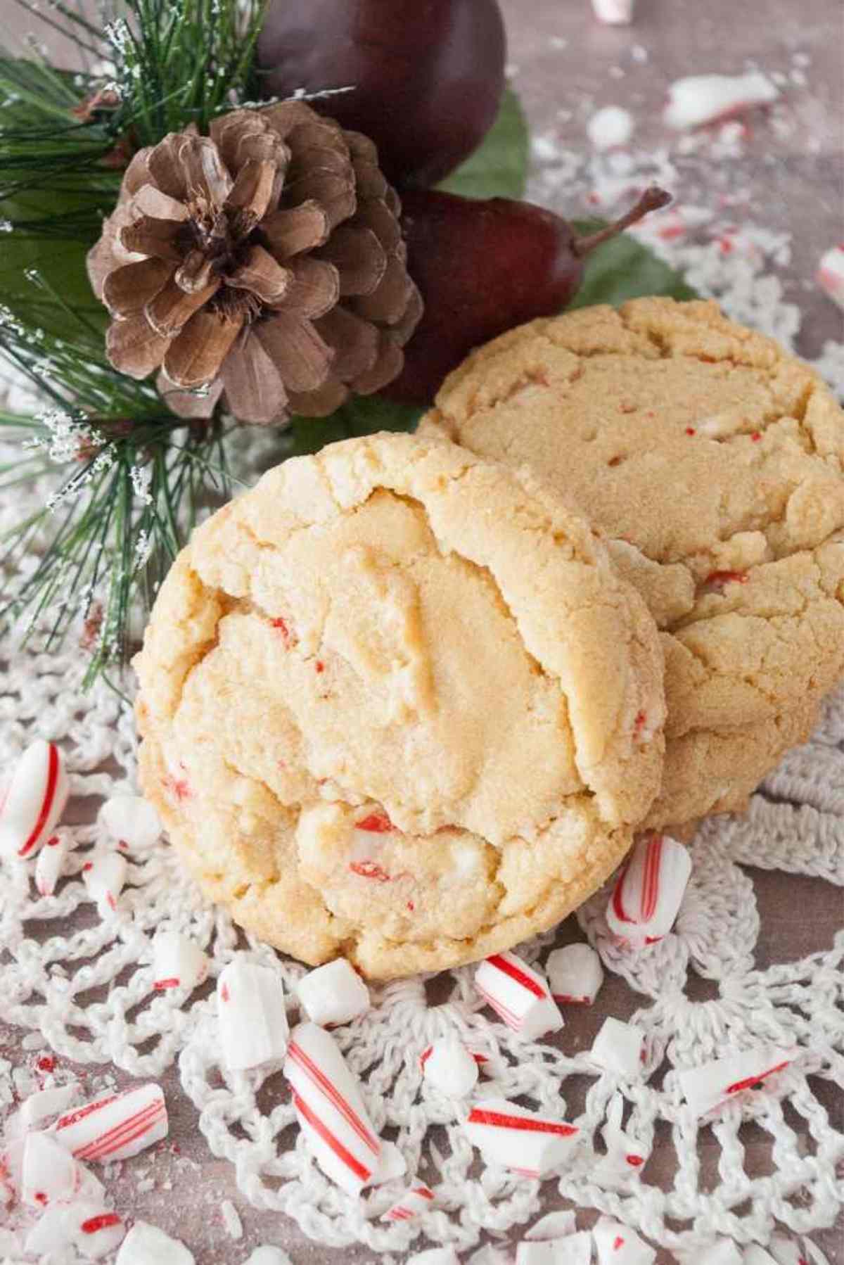 Candy Cane cookies on a doily garnished with candy cane pieces.