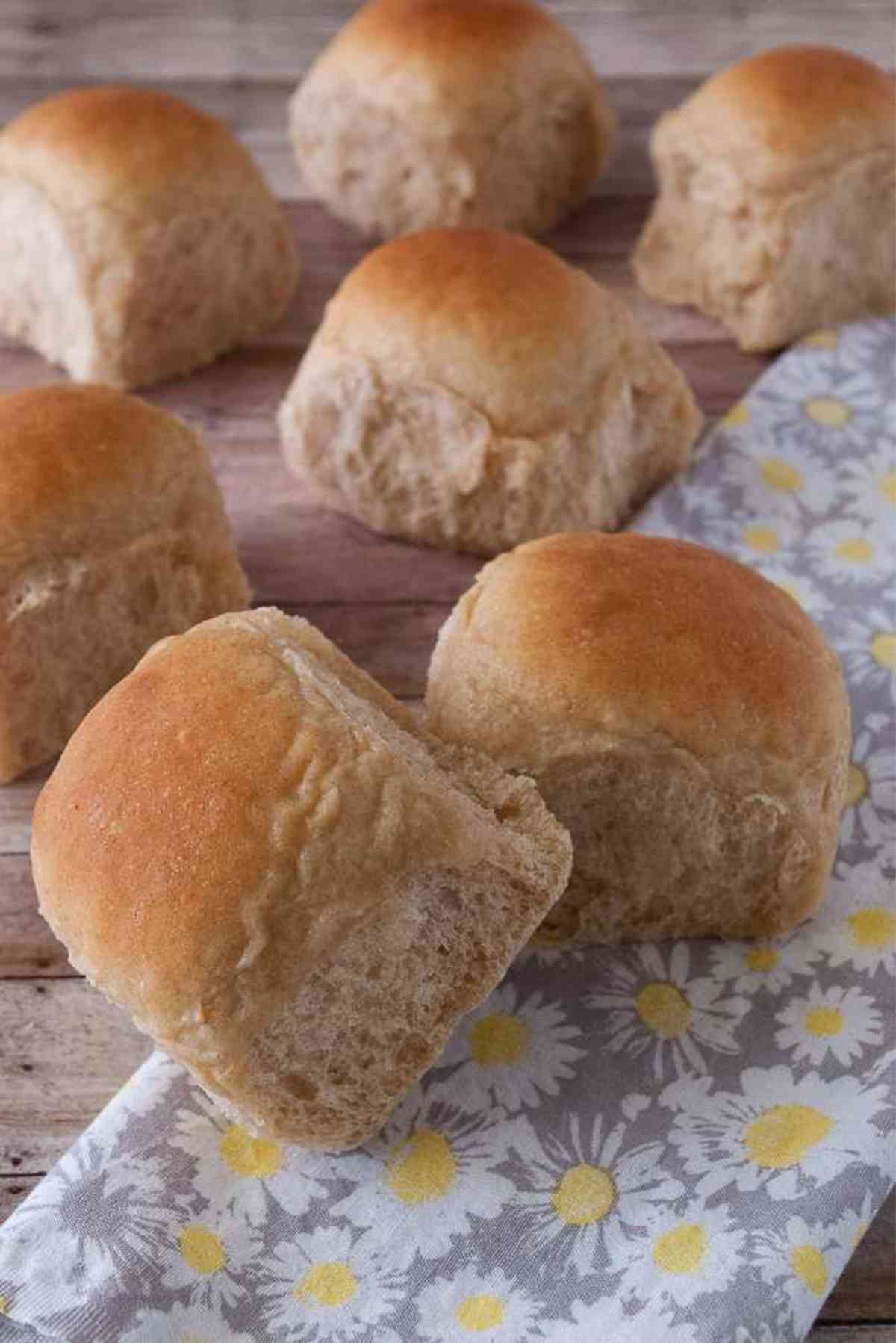 Fresh whole wheat dinner rolls ready to eat.