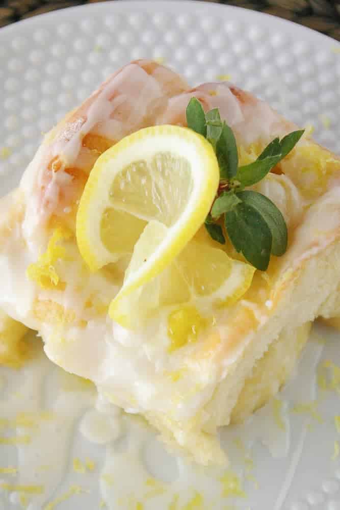 A lemon sweet roll on a plate.