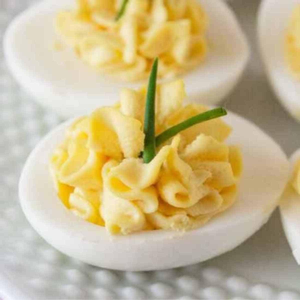 A deviled egg half on a plate.