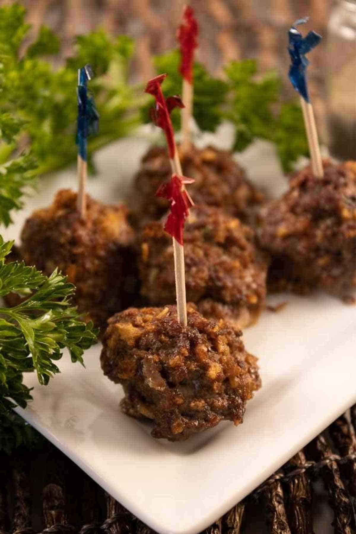 Meatballs with deli picks in the tops.