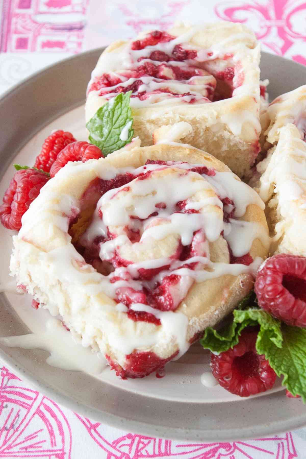 Plate of raspberry cheesecake sweet rolls.