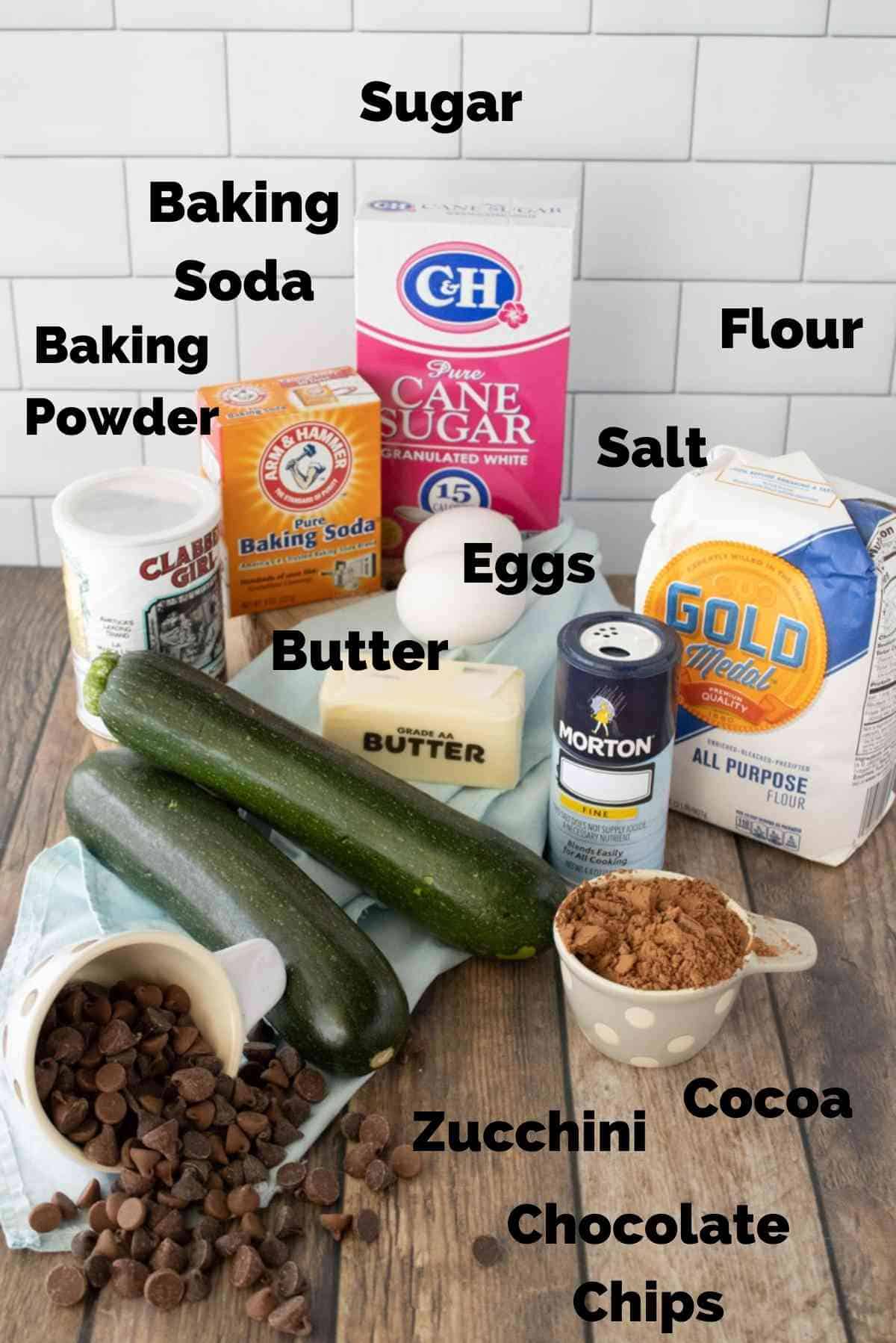 Ingredients for chocolate zucchini bread that include shredded zucchini, cocoa, and chocolate chips.