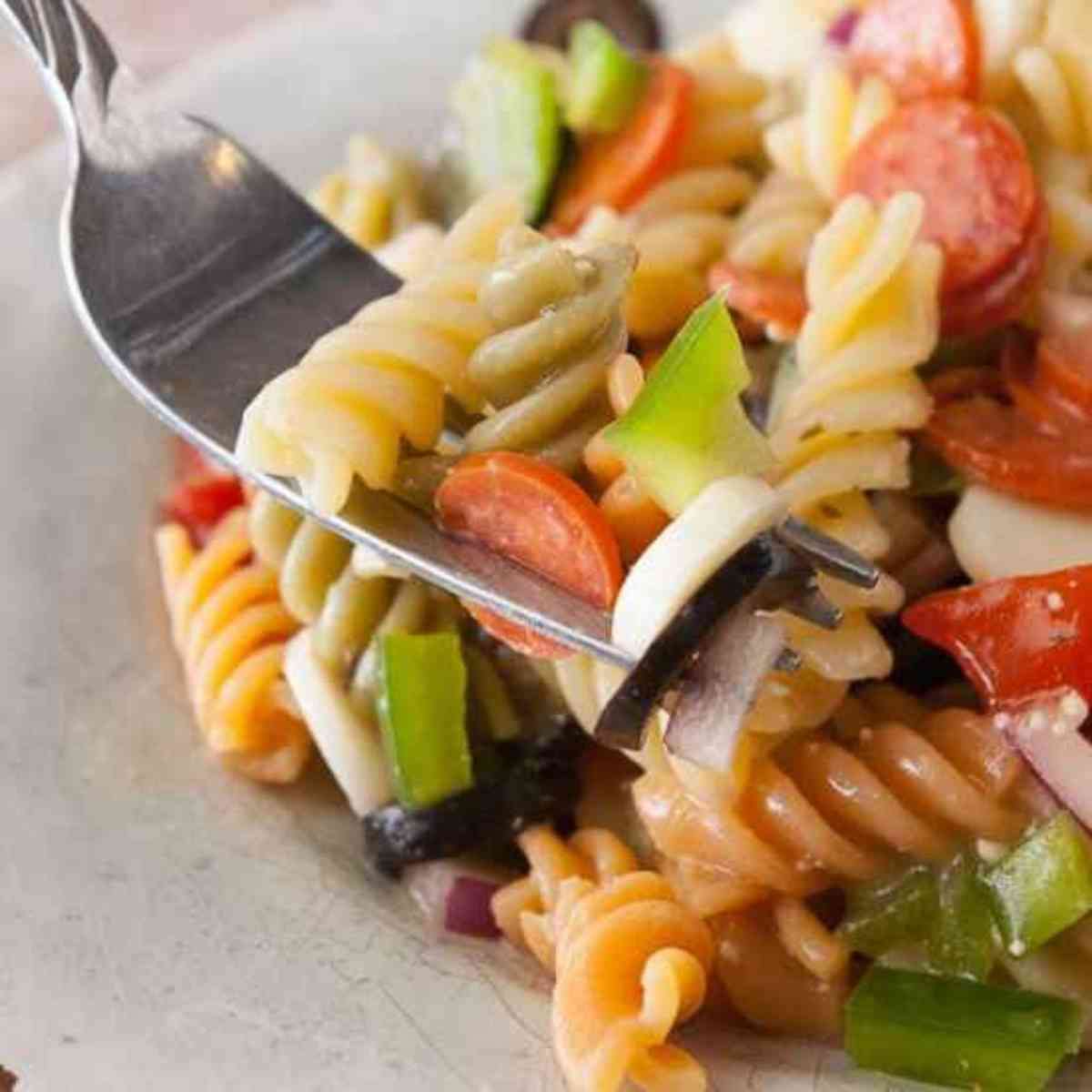 Forkful of italian pasta salad.