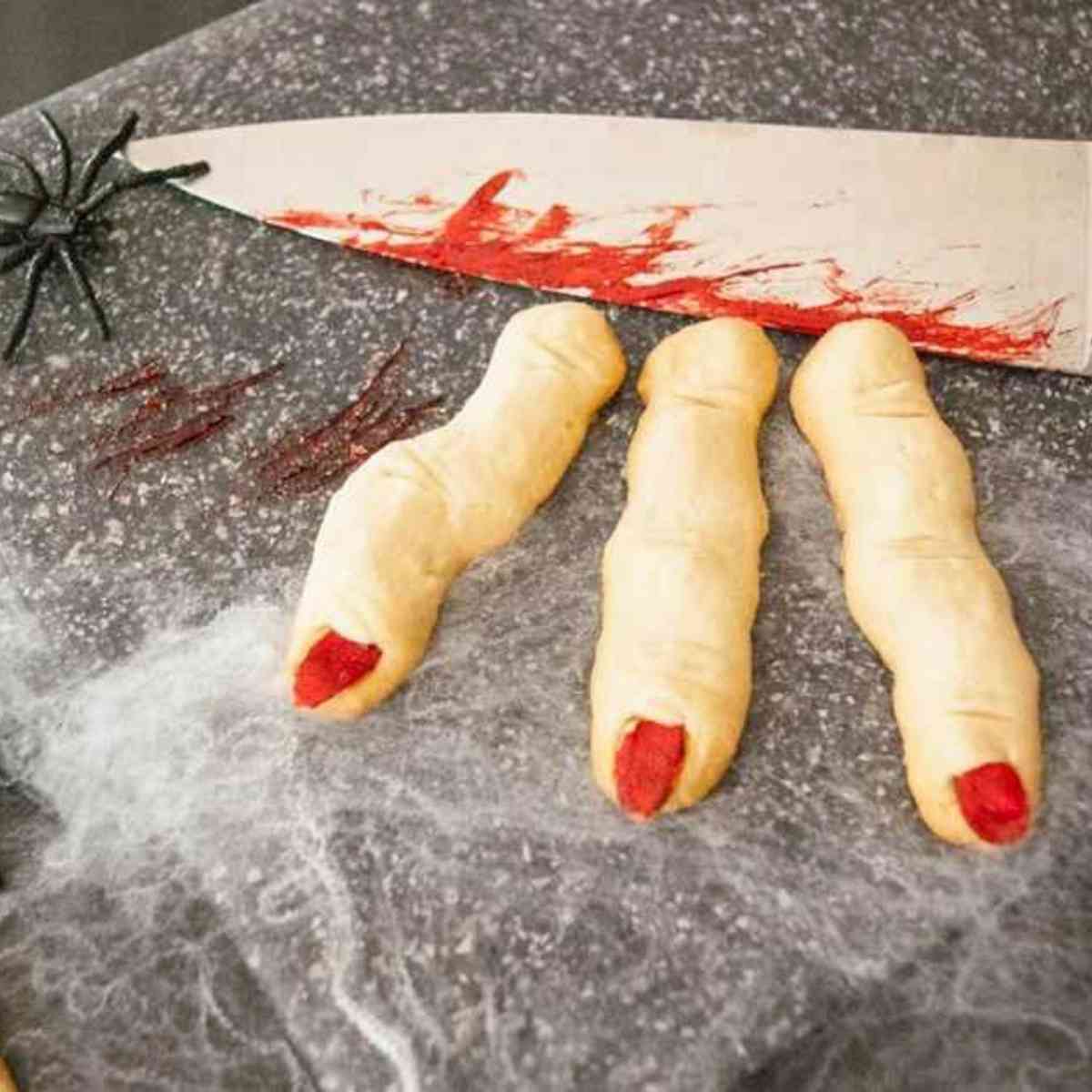 Witch Finger Cookies severed with a knife.