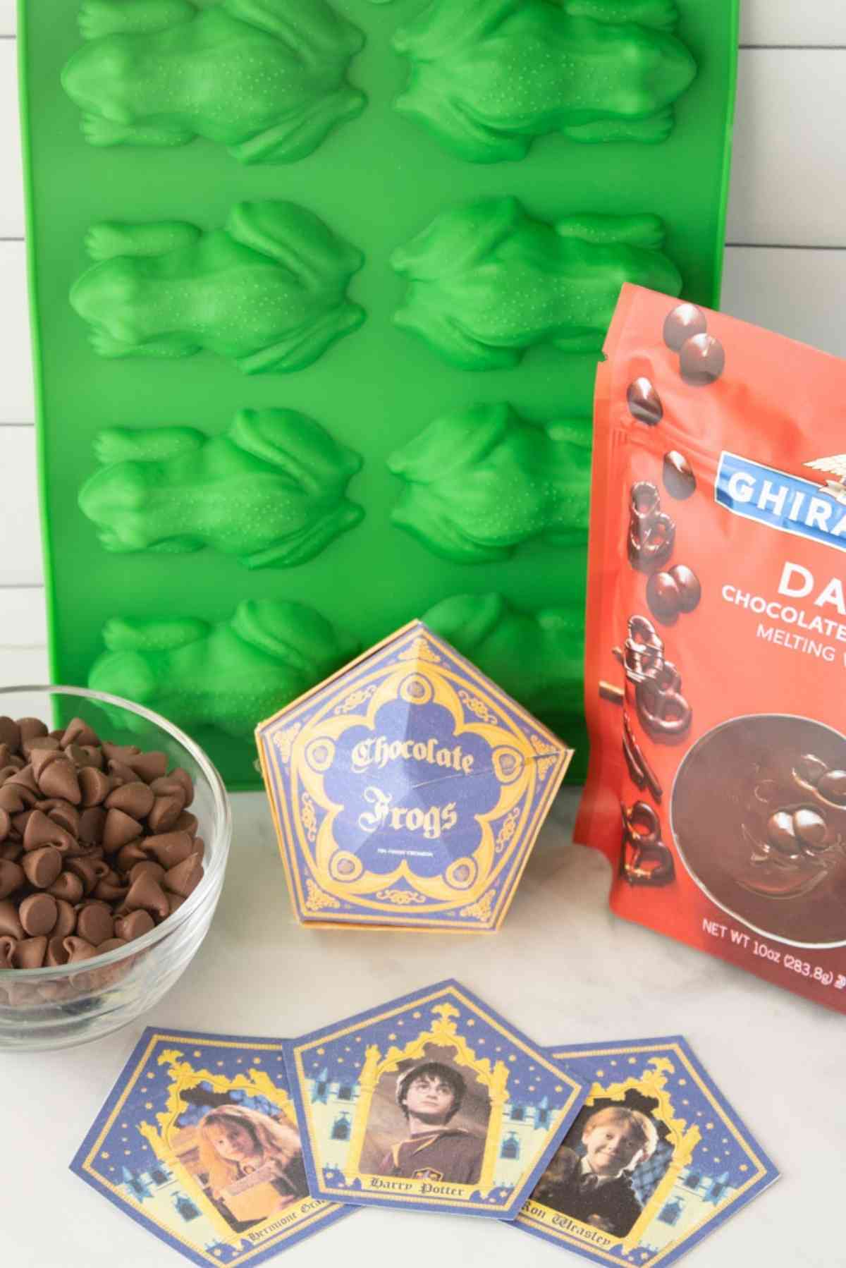Frog molds, chocolate frog boxes, milk chocolate chips, dark chocolate melting wafers.