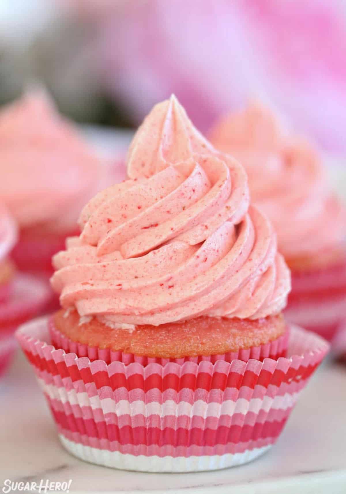 A cupcake with Strawberry Buttercream Frosting.