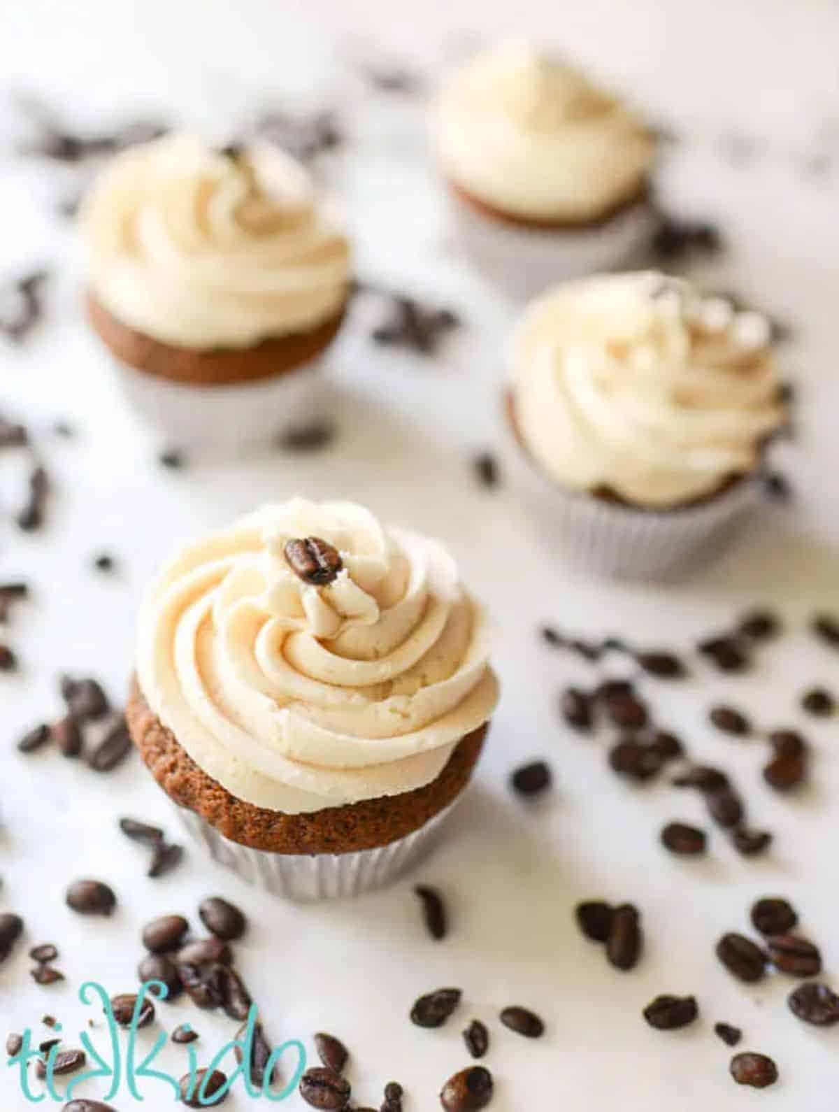 Four cupcakes with Bailey's Irish Cream Buttercream Frosting.