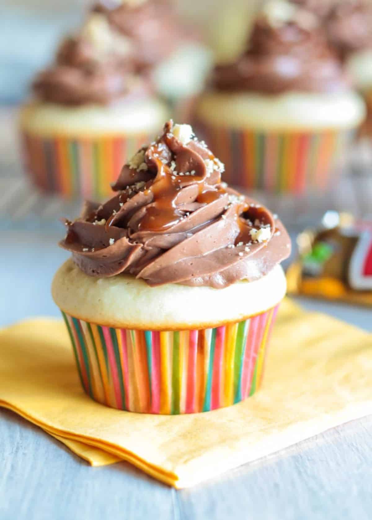 Twix-Stuffed Cupcake on a yellow napkin.