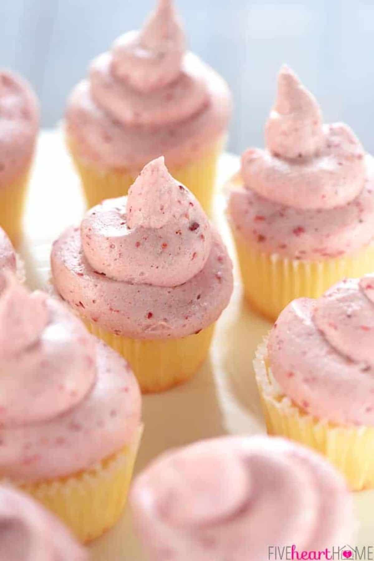 A bunch of cupcakes with Strawberry Cream Cheese Frosting.