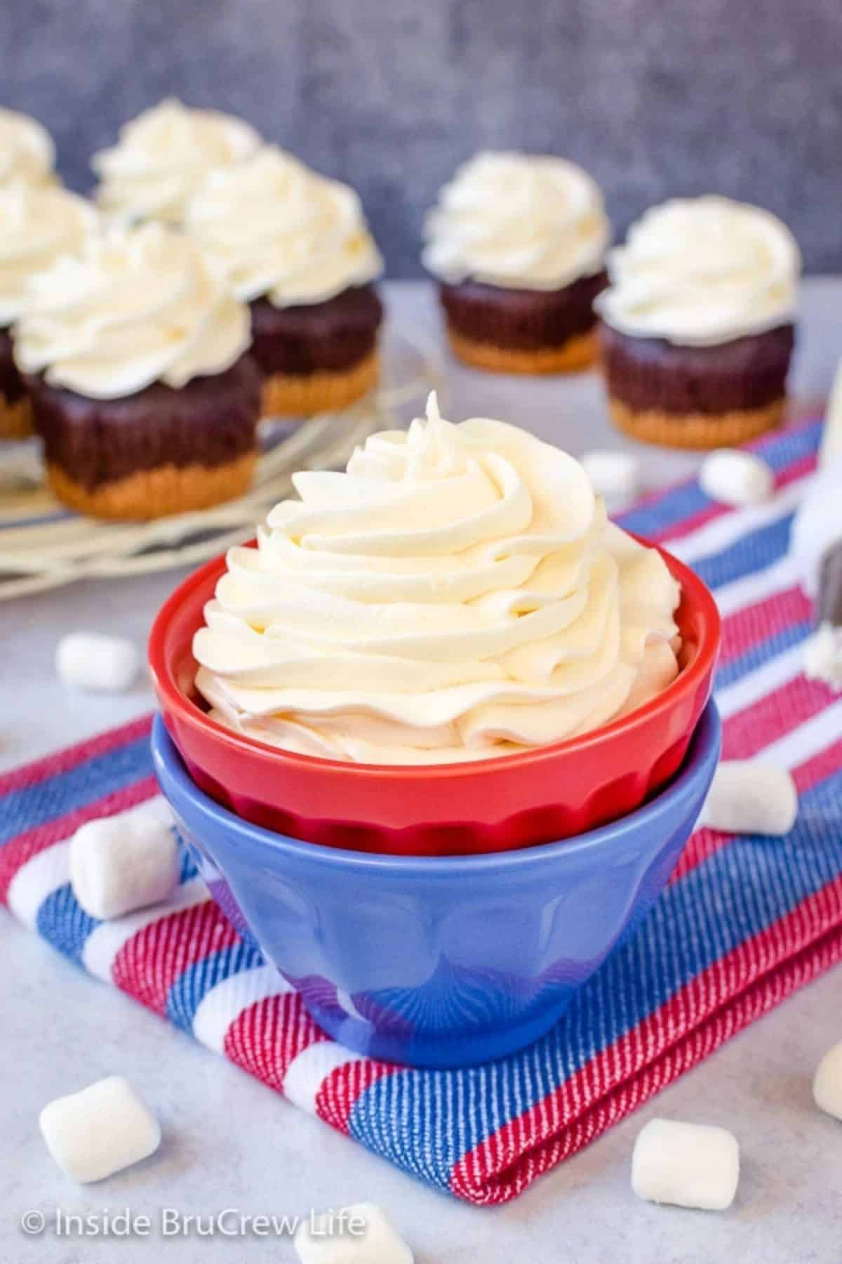 Fluffy, Marshmallow Buttercream Frosting in a small red bowl.