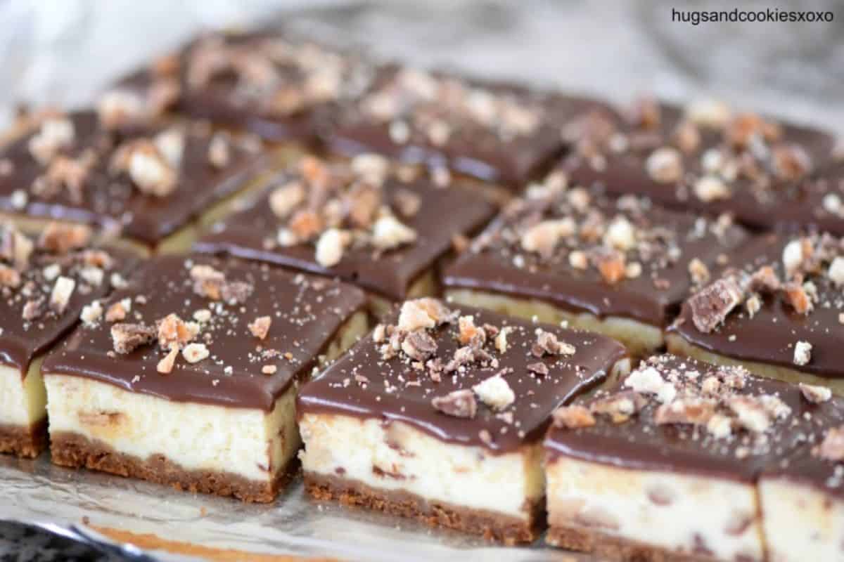 Twix Cheesecake Bars on a cellophane foil..