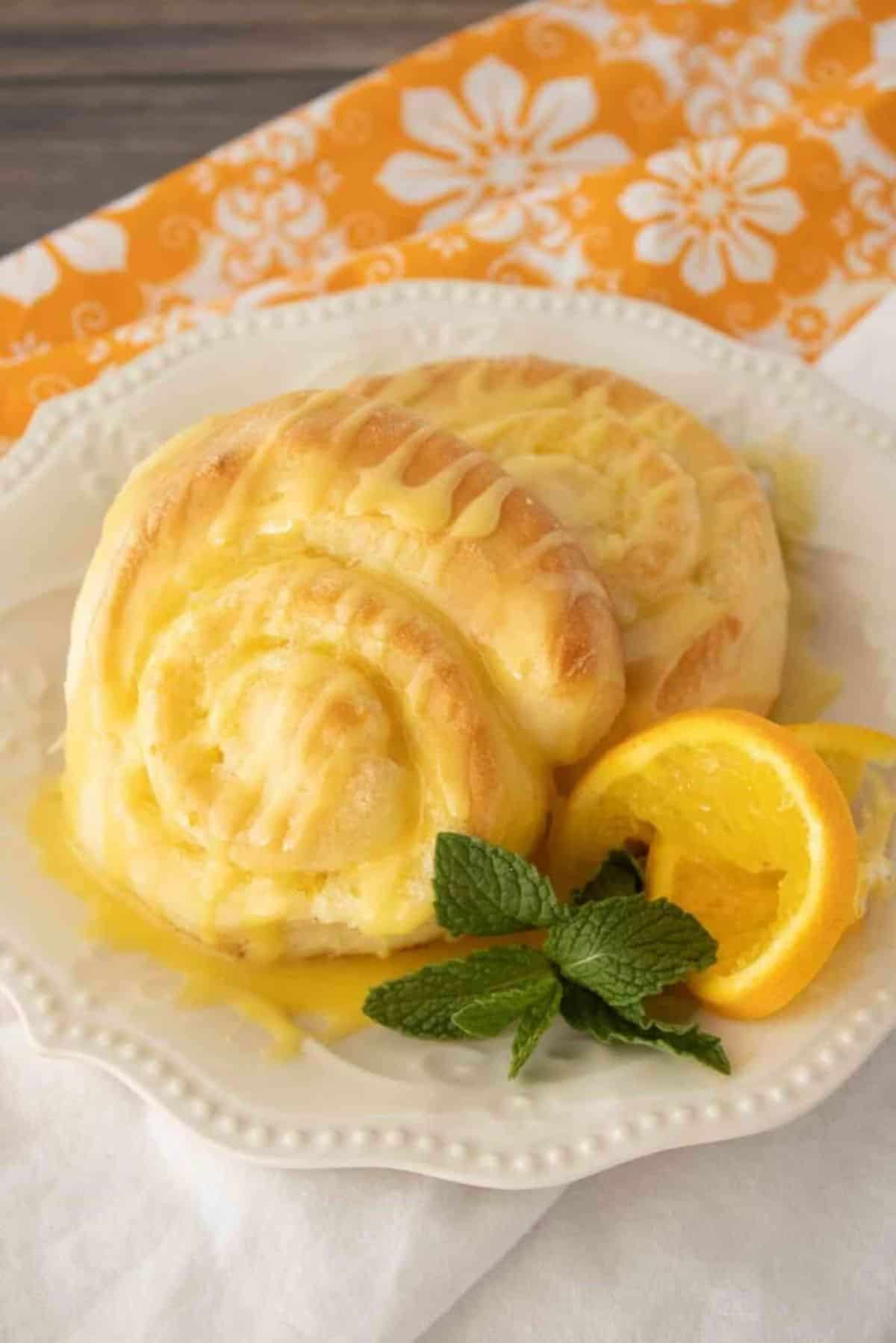 Orange Rolls  on a fancy white plate.