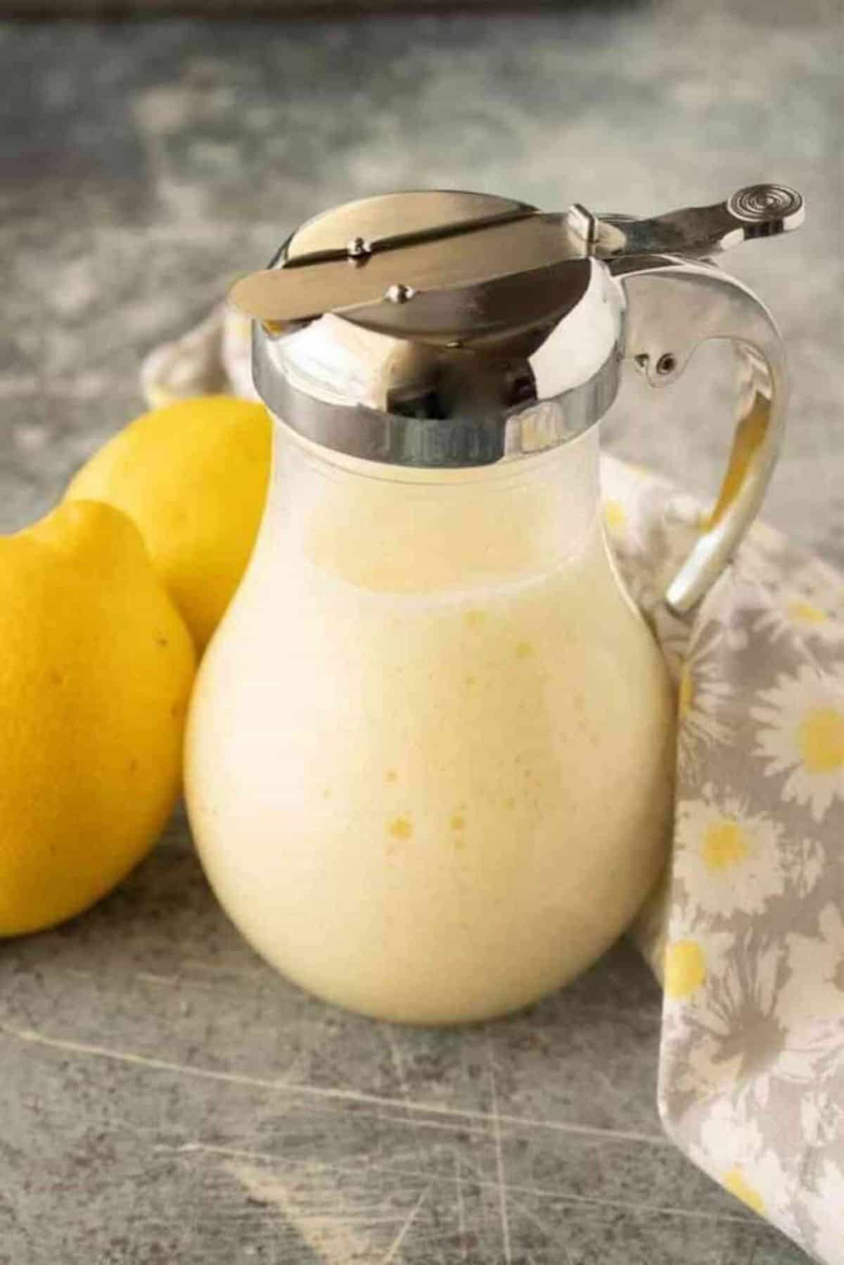 Cream Cheese Syrup for Pancakes in a glass pitcher.
