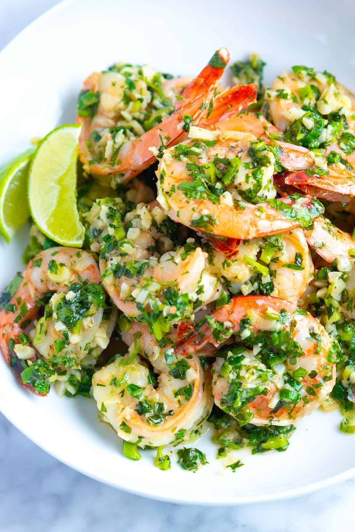 Garlic Butter Shrimp with Cilantro and Lime on a white plate.