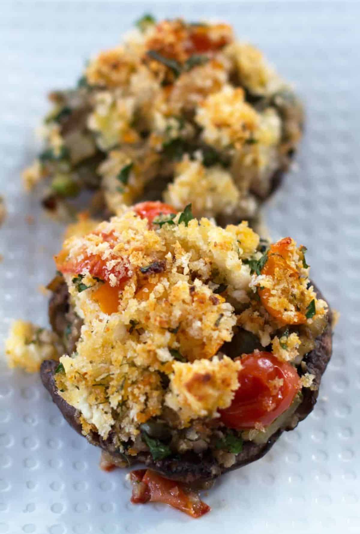 Dill and Feta Stuffed Mushrooms on a white tray.