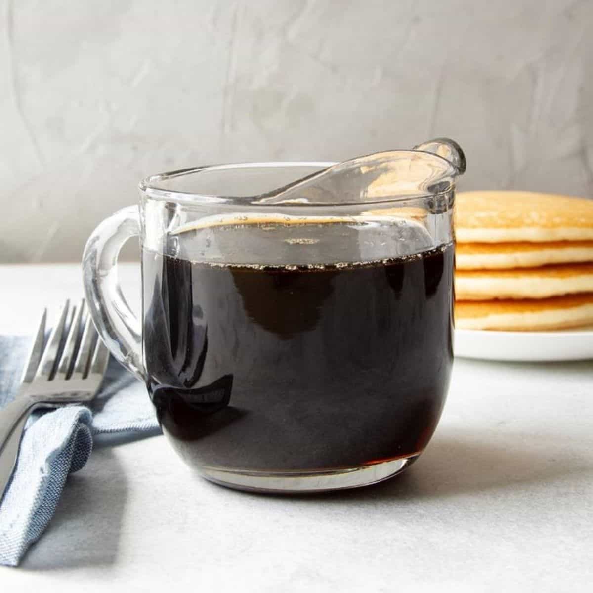 Homemade Pancake Syrup in a glass cup.