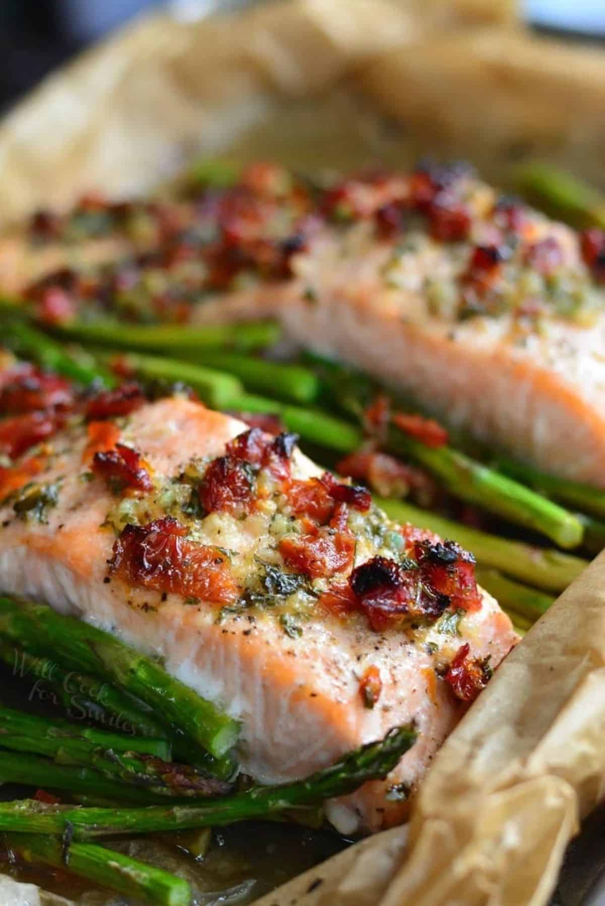 Sun-dried Tomato Lemon Baked Salmon and Asparagus in a casserole.