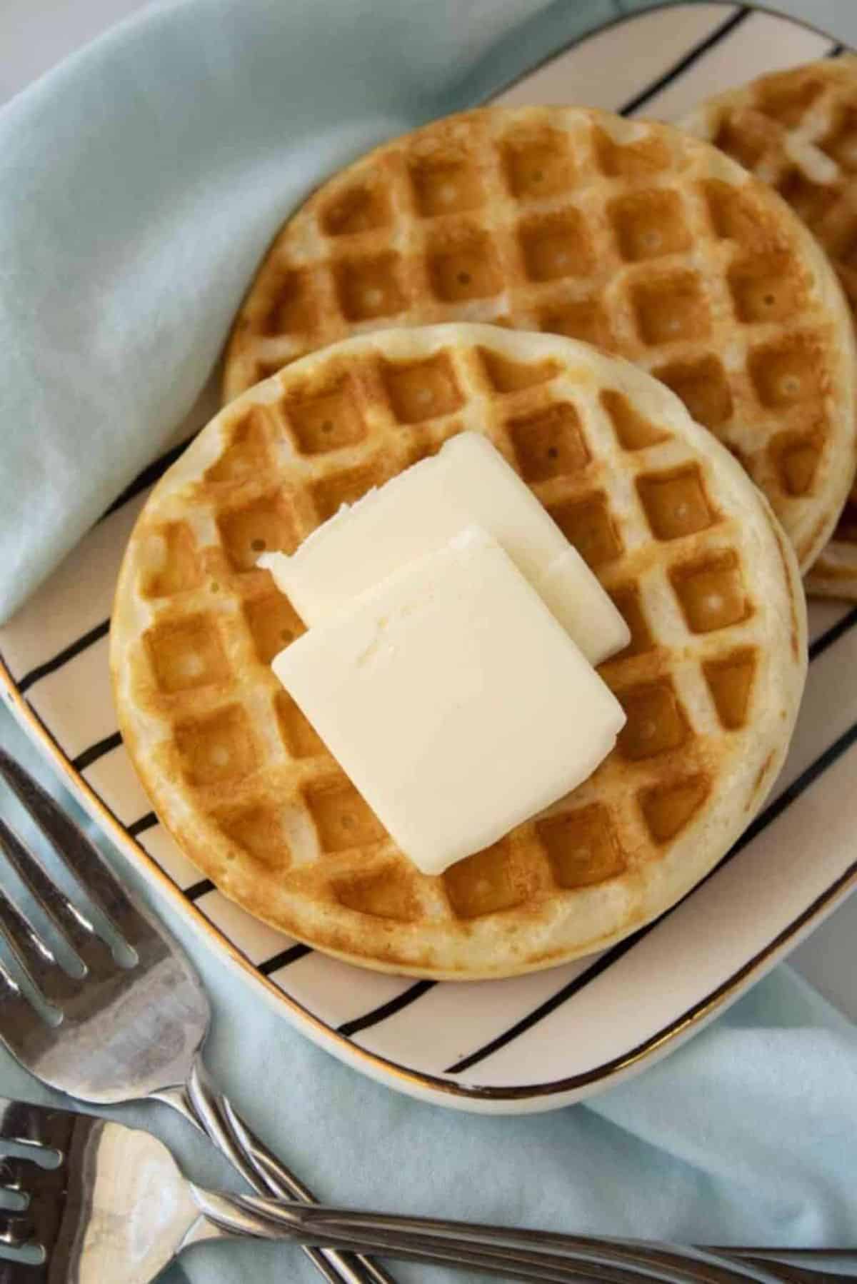 Three delicious Fluffy Waffles on a tray.