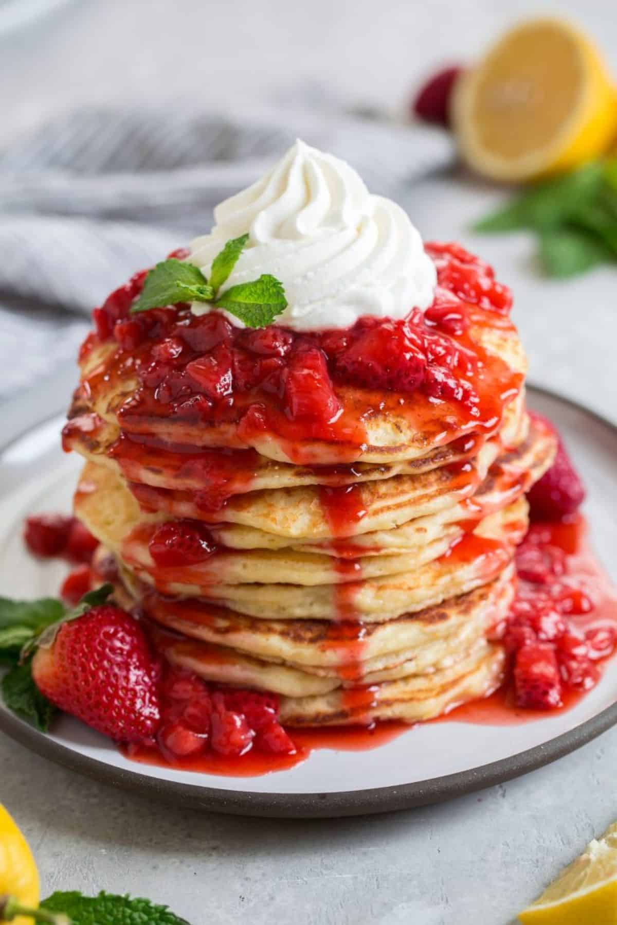 Strawberry Syrup on a pile of delicious pancakes.