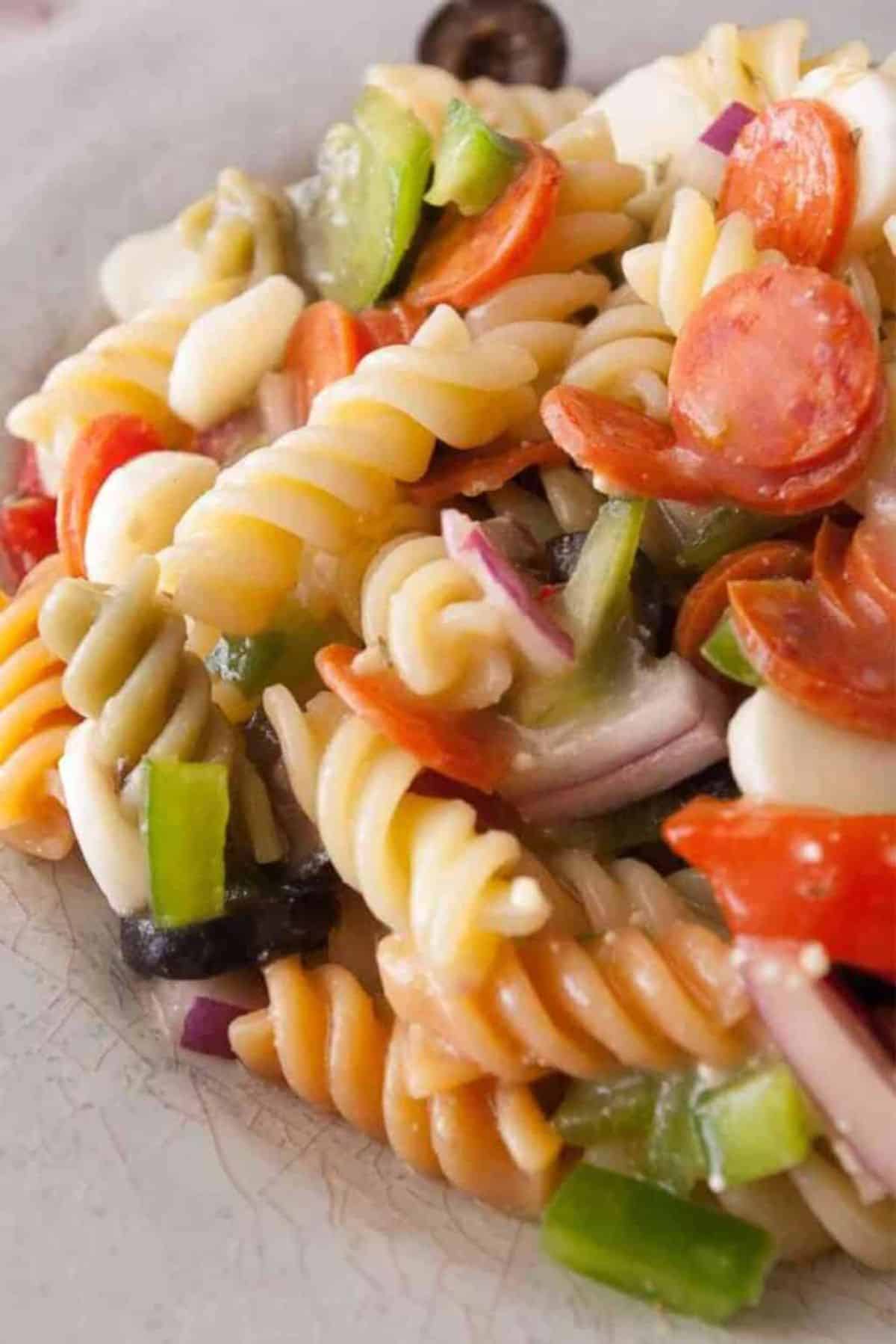 Zesty Italian Pasta Salad on a gray plate.