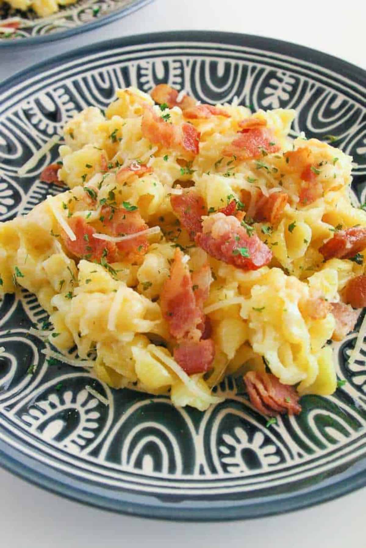 Scrumptious Slow Cooker Mac and Cheese on a decorative plate.