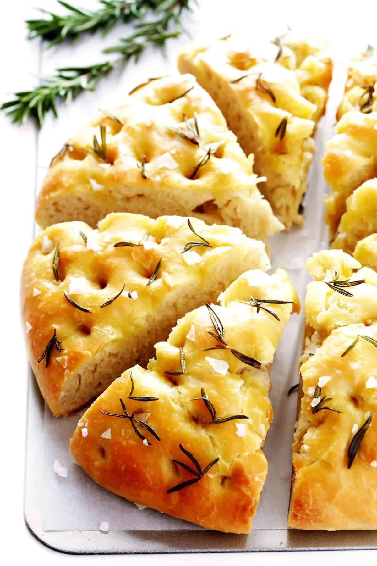 Sliced Rosemary Focaccia Bread on a metal tray.