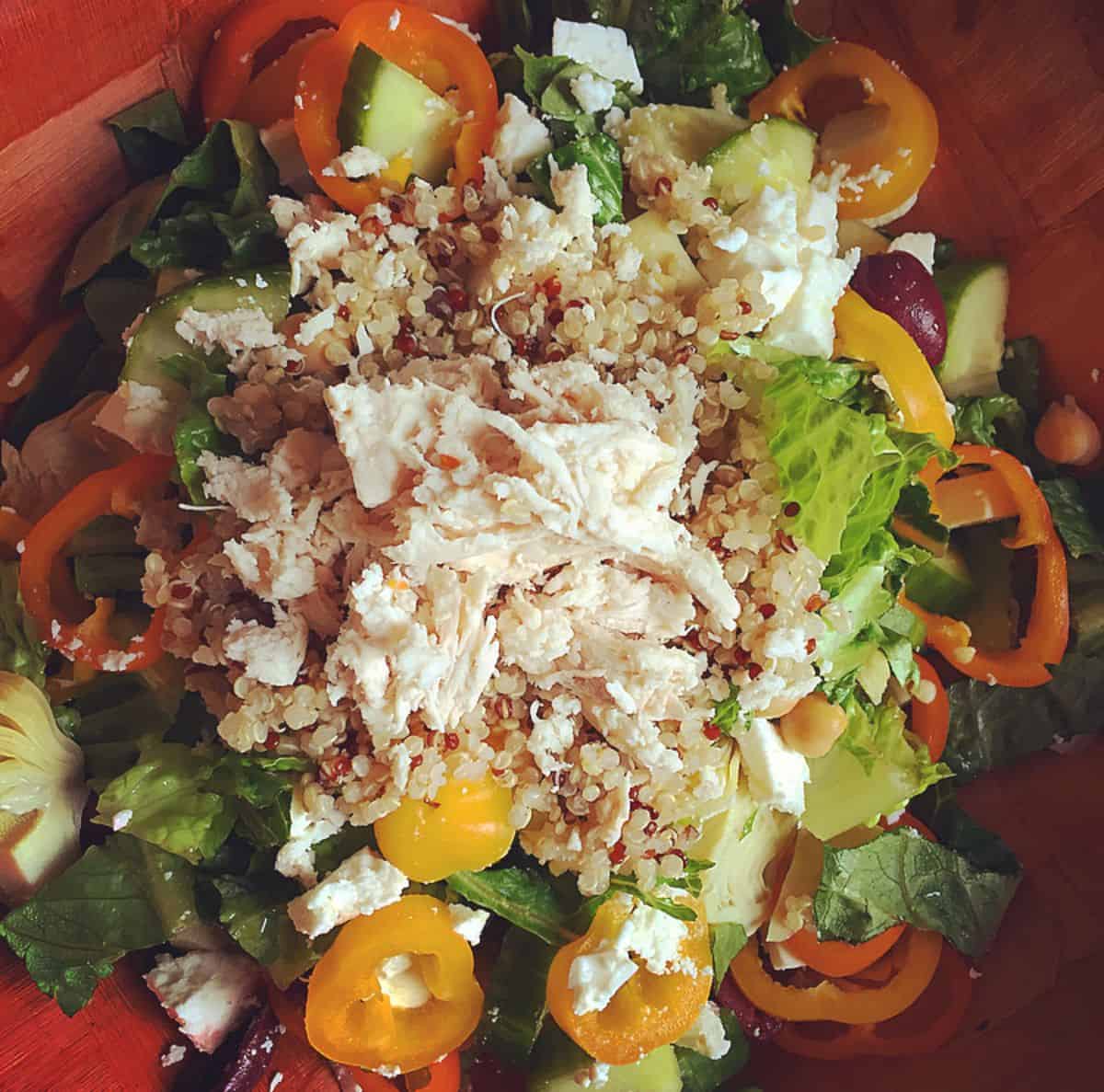 Mediterranean Salad in a red bowl.