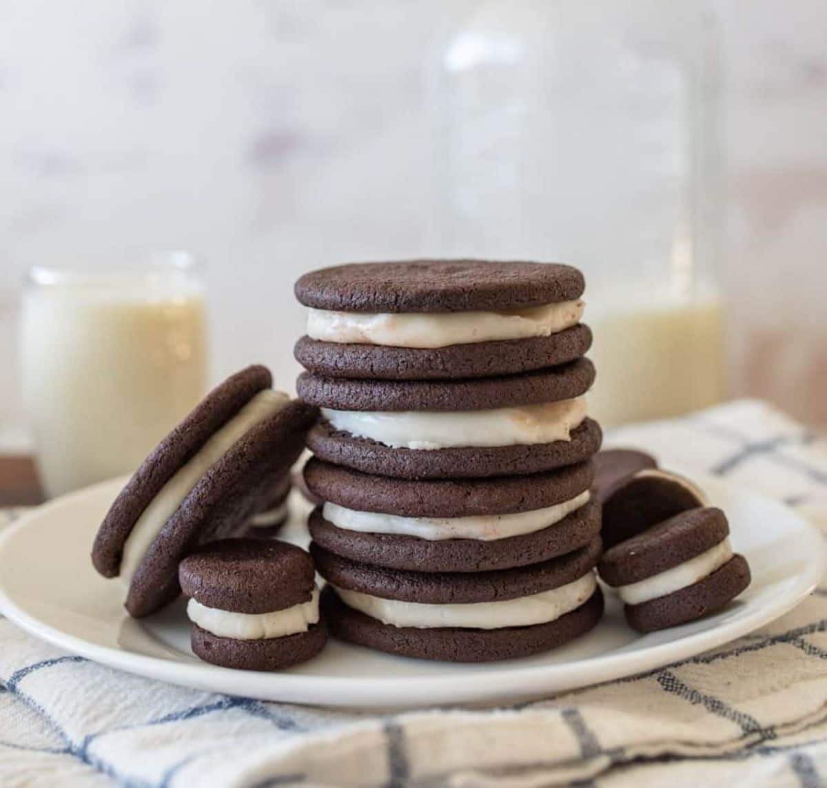 A bunch of Oreo Cookies on a white plate.