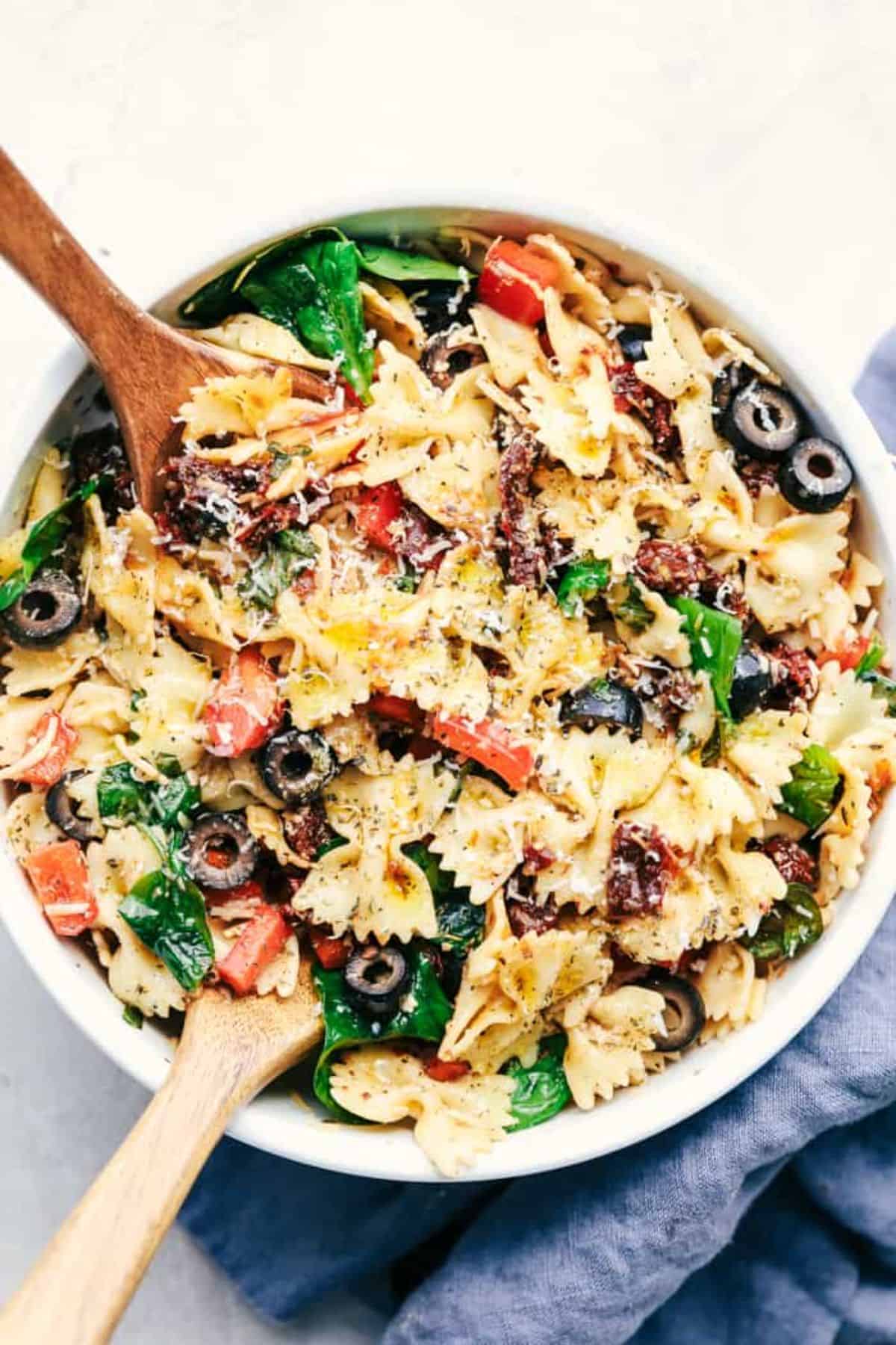 Delicious Tuscan Pasta Salad in a white bowl.