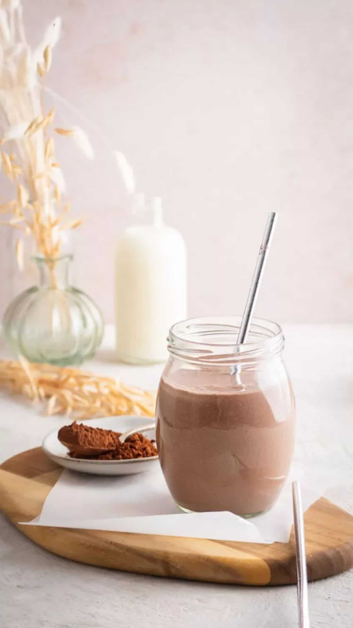 Chocolate Shake in a glass cup with a straw.