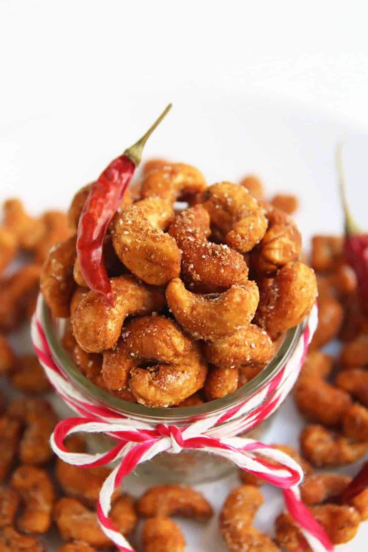Sweet and Spicy Cashews in a glass jar.