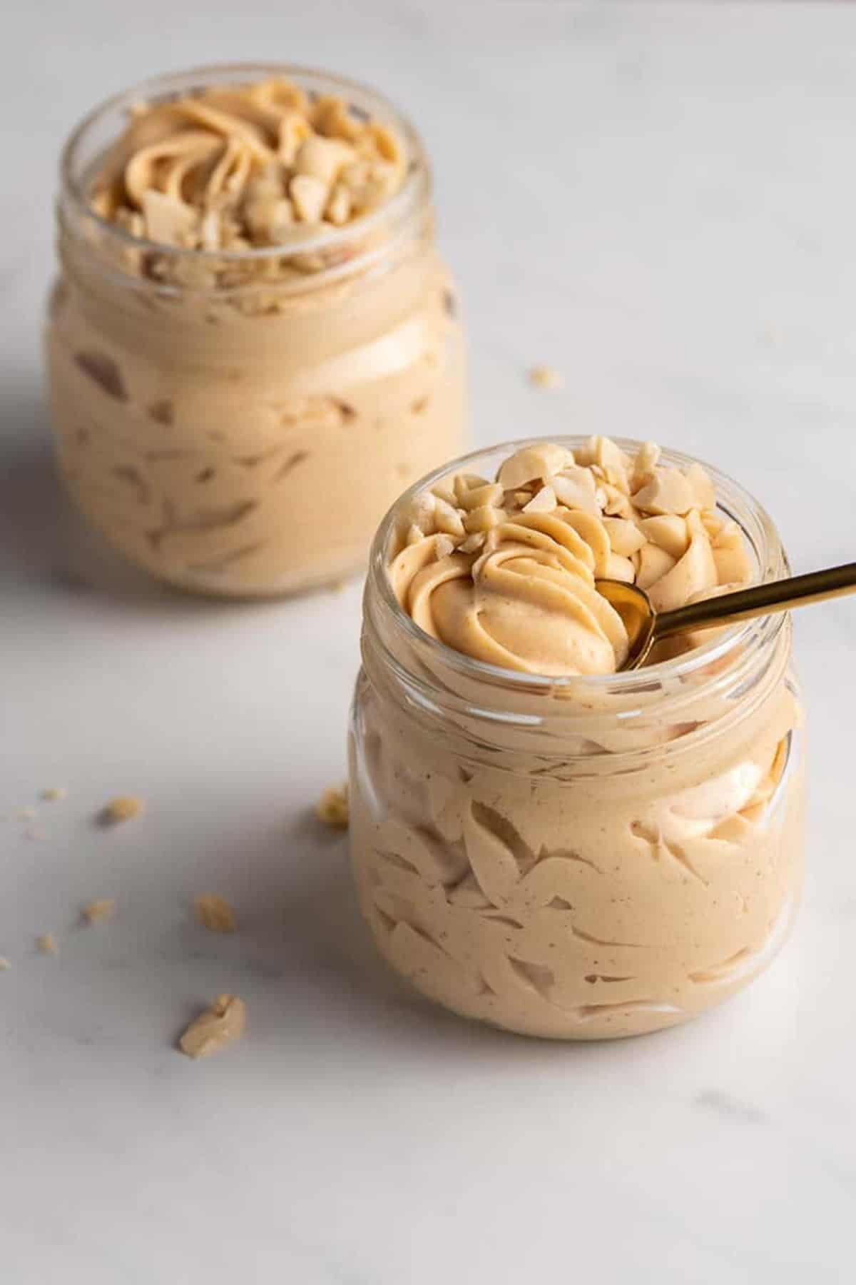 Peanut Butter Mousse in two glass jars.