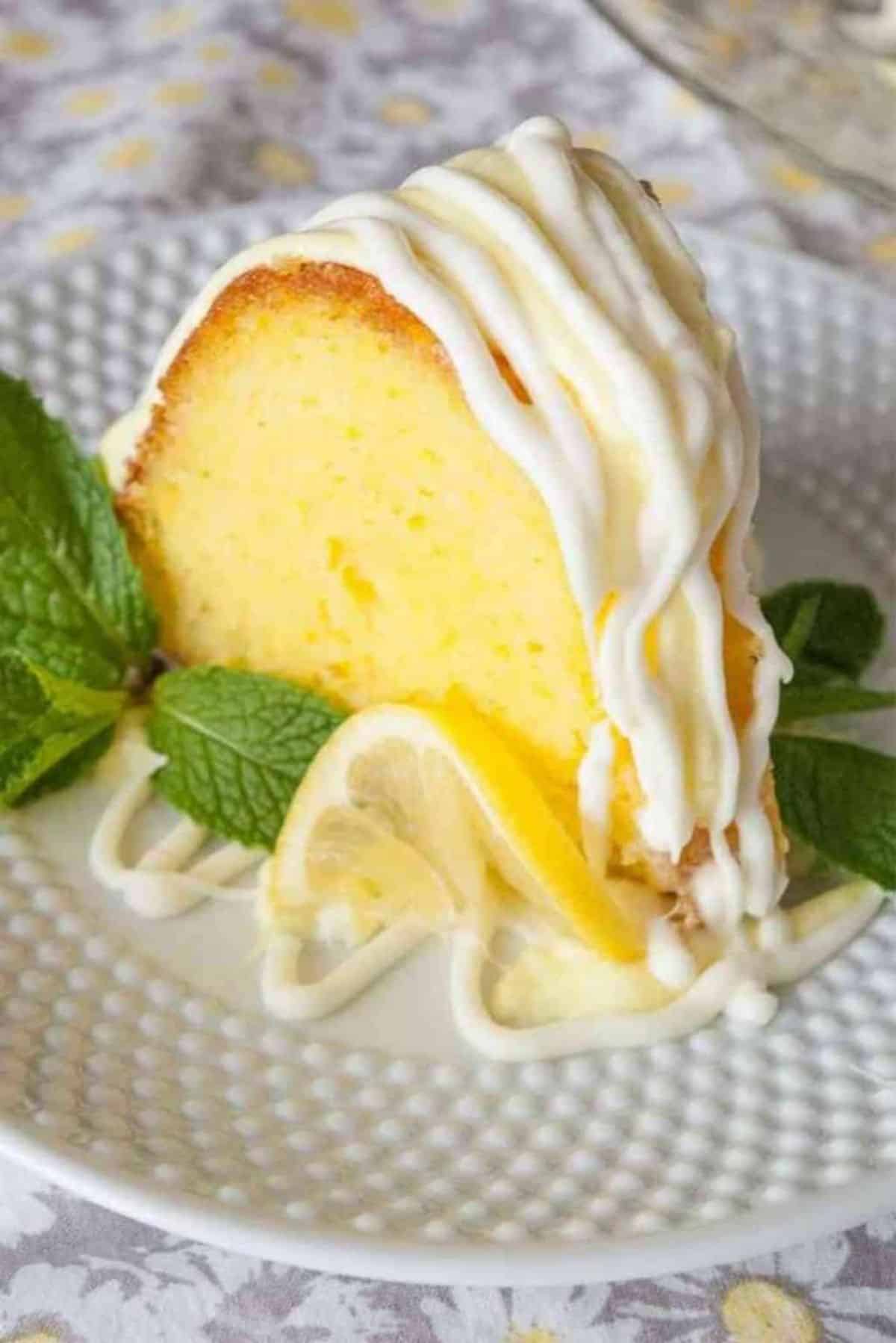 A piece of delicious Easy Lemon Bundt Cake on a white plate.
