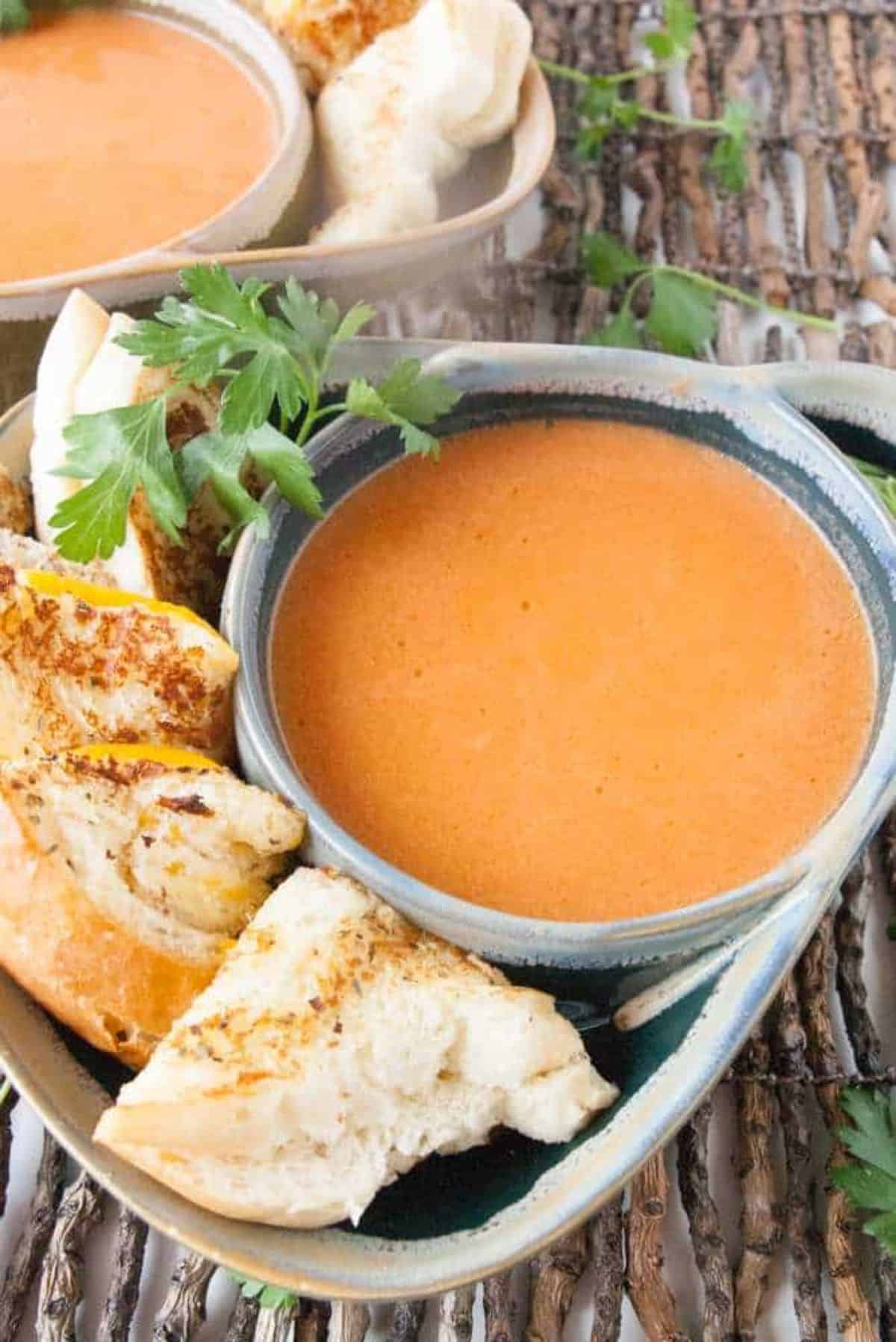 Delicious Light and Easy Tomato Soup in a gray bowl.