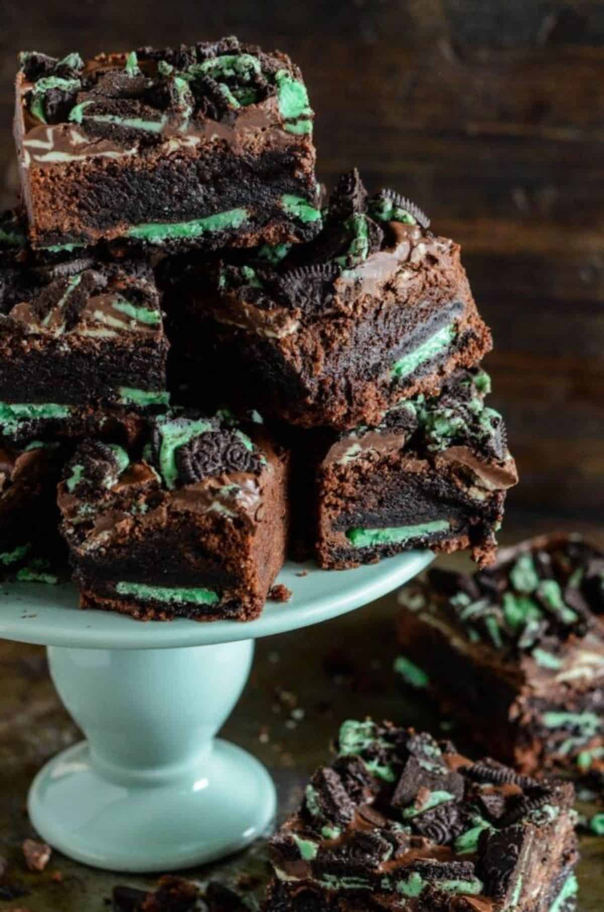 A pile of Ultimate Mint Brownies on a cake tray.