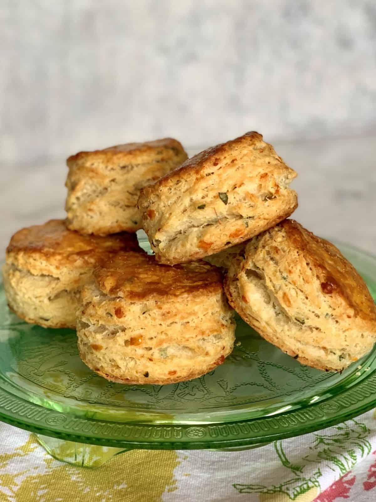Cheddar and Herb Biscuits on a glass tray.