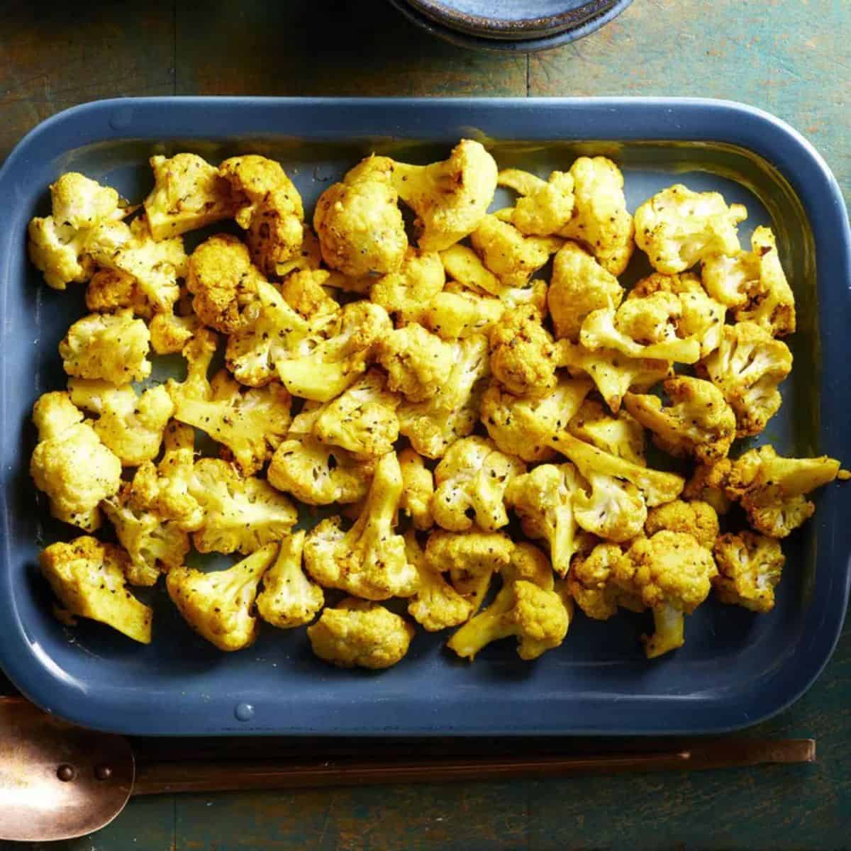 Roasted Cauliflower With Turmeric in a blue casserole.