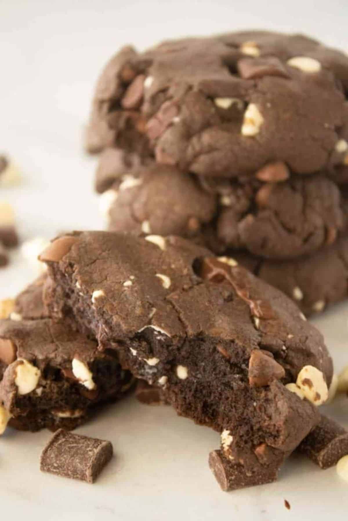 Delicious Triple Chocolate Chip Cookies on a white tray.