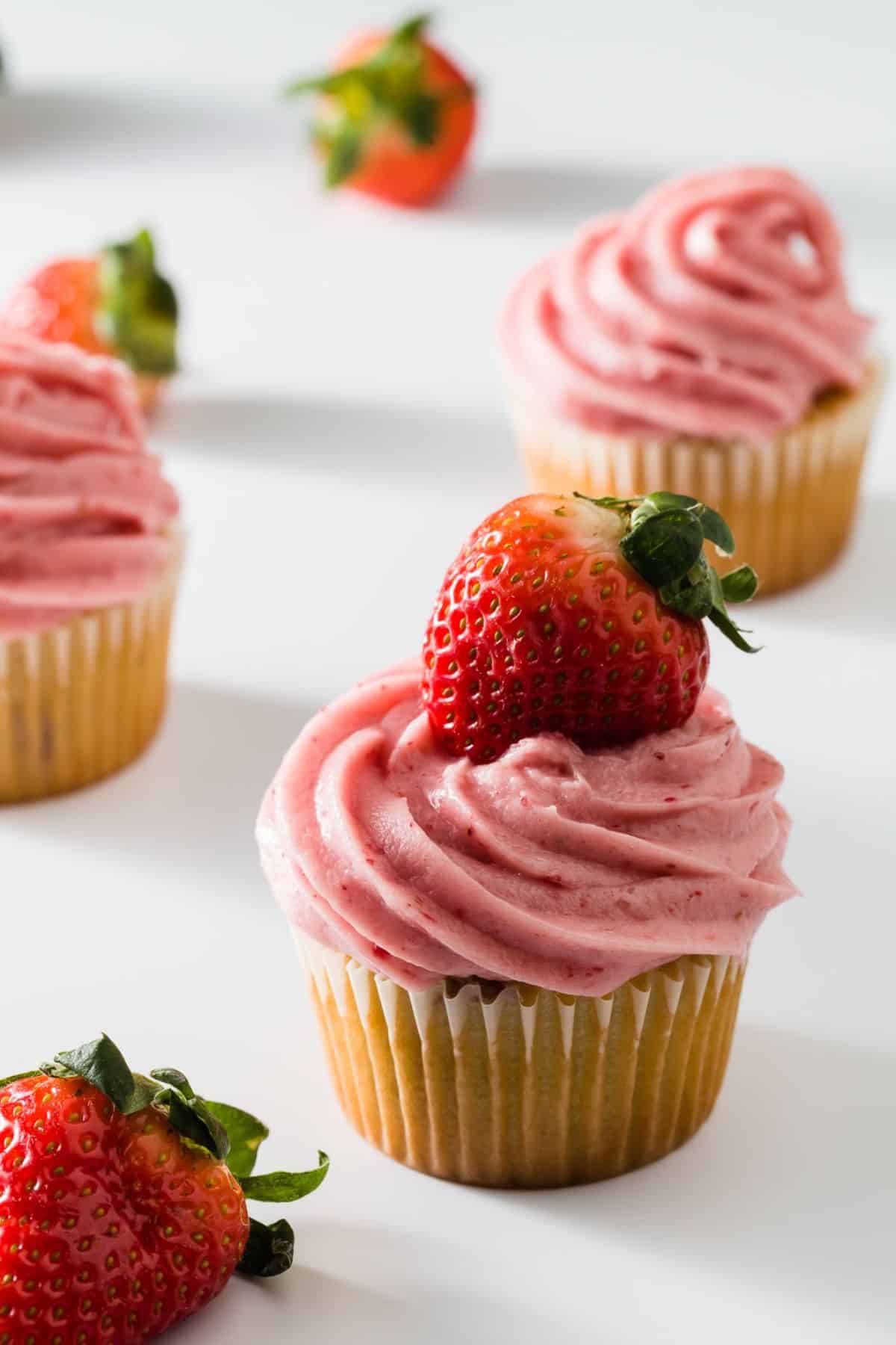 Strawberry Cream Cheese Frosting on cupcakes.