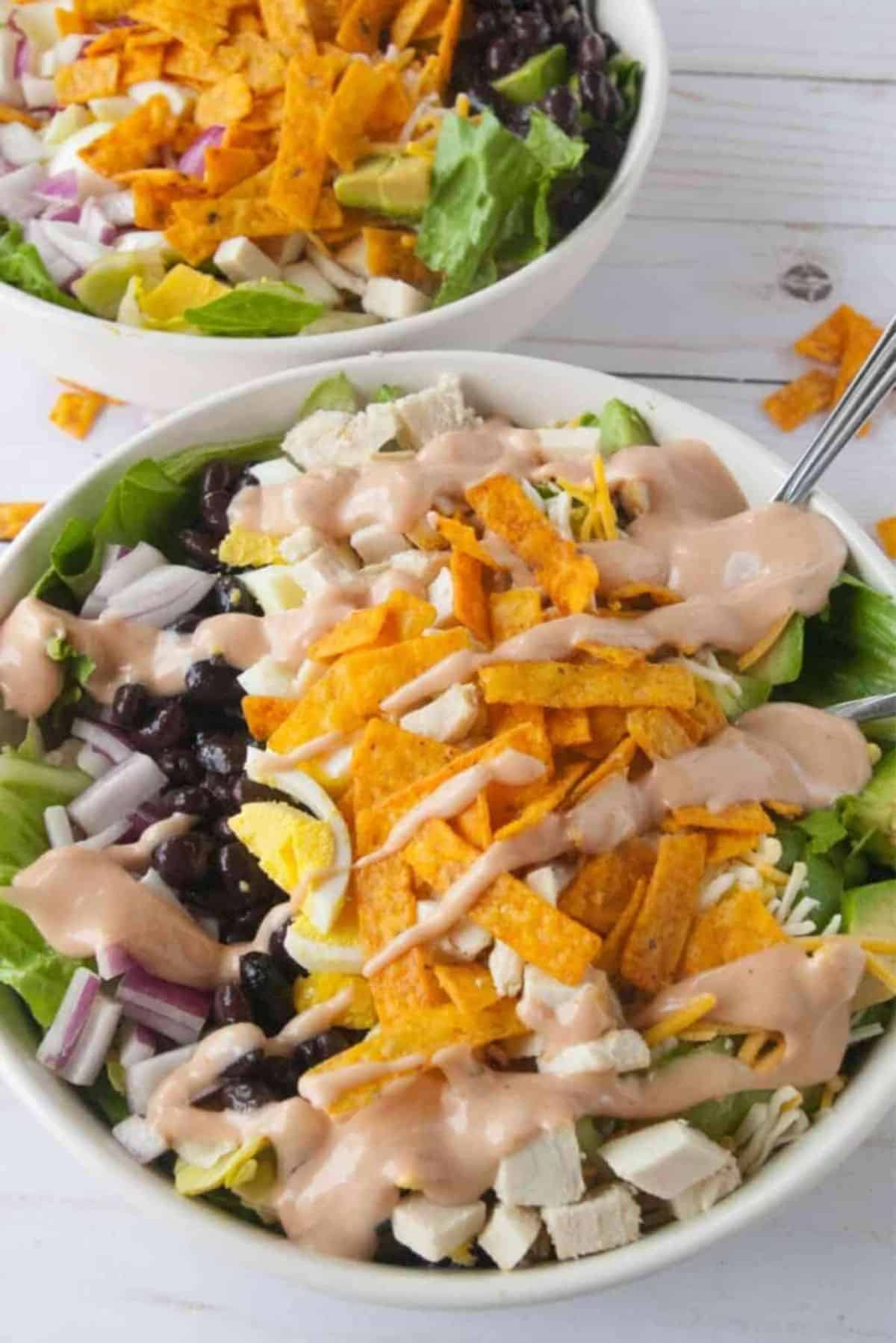Delicious Southern BBQ Chicken Salad with Barbeque Ranch Dressing in a white bowl.